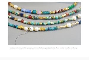 Close-up of handmade beaded necklace with turquoise, coral, and freshwater pearls