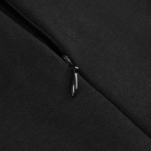Detailed macro view of invisible black zipper closure on sleek fishtail evening gown