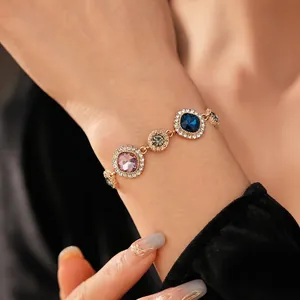 Vintage geometric gold bracelet with multi-color crystals and shimmering pavé diamonds
