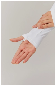Detail showing the functional thumb hole design on the white long-sleeve athletic top