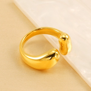 Minimalist 18K gold plated adjustable stainless steel ring with teardrop design on silk