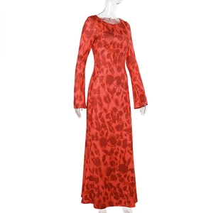 Detailed view of the red floral print fabric and long sleeve texture on a maxi dress