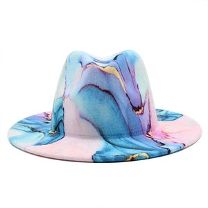 Detail of artistic wool fedora featuring fluid blue, pink, and gold marble pattern print