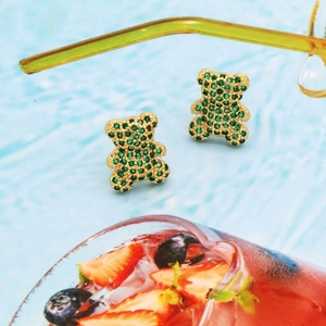 Cute teddy bear stud earrings featuring gold plating and vibrant green zircon stones