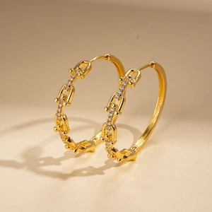 Close-up of 18K gold plated U-shaped link earrings with sparkling zircon stones