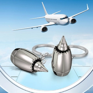 Polished silver aircraft engine turbine keychain pair with high-quality metal finish