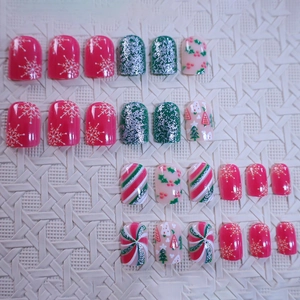 Christmas press-on nails set with red and green patterns, snowflakes and glitter