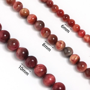 Detailed view of natural tiger eye stone beads in 6mm, 8mm, and 10mm sizes for jewelry