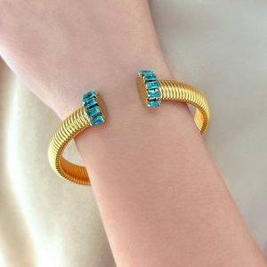 Bracciale Tubogas placcato oro 18K con eleganti pietre blu con taglio rettangolare