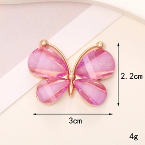 Detail view of pink butterfly charm with dimensions 3cm x 2.2cm and 4g weight specs