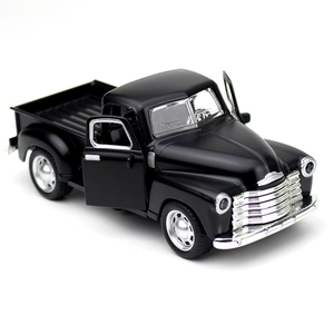 Detail view of the black vintage alloy pickup truck model with openable doors showing interior