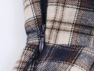 Detail of the high-quality plaid fabric texture with a concealed matching invisible zipper