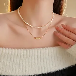 Minimalist double-layered irregular pearl and gold curved tube pendant necklace for women