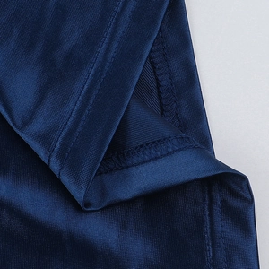 Macro detail of navy blue satin fabric with reinforced stitching and mesh texture