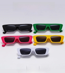 Detailed row of rectangular narrow frame sunglasses in five trendy colors on white