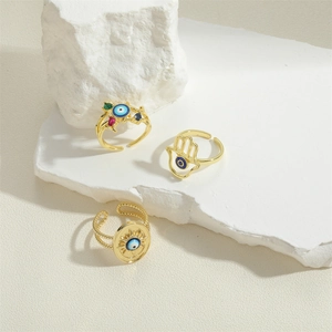Three-piece gold-plated Hamsa Hand and Evil Eye adjustable ring set with colorful stones