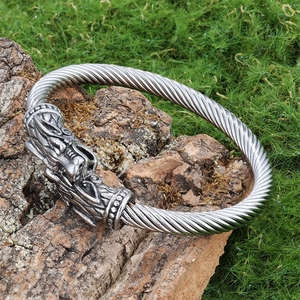 Vintage silver Viking wolf head open bracelet with a detailed twisted cable band design