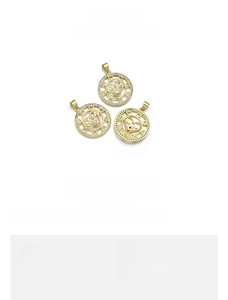 Detail of 18K gold plated MAMA round pendant with hollow heart border and micro-inlay