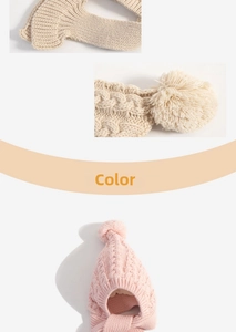 Detail of cable knit baby hat with earflaps and pompom in beige and pink colors