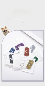 Glittery rectangle pet ID tags with paw print detail in individual OPP packaging