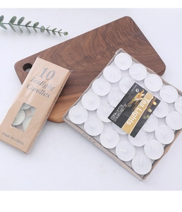 Detail of 10 and 50 pack white smokeless tealight candles in aluminum cups on a wood tray