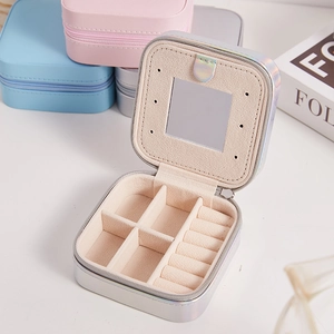 Portable PU leather jewelry organizer with mirror and multi-compartment storage in pastel colors