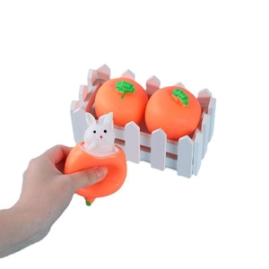 Carrot squeeze fidget toy with a white bunny popping out, soft silicone relief toy