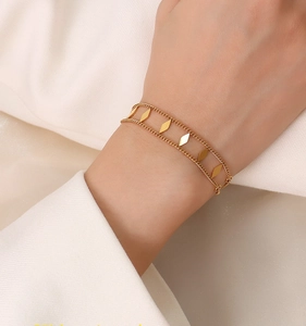 Detailed close-up of a double-layered 18k gold plated geometric rhombus bracelet