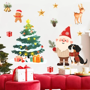 Detail of Christmas wall stickers featuring Santa, a puppy, and tree on a white wall
