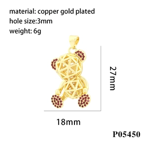 Detailed view of hollow teddy bear pendant in gold plated copper with size markings