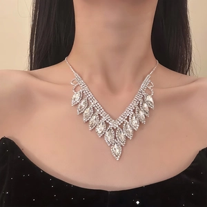 Elegant silver V-shaped necklace set with sparkling rhinestones on professional model