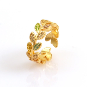 Detailed shot of olive leaf open ring with colorful enamel and micro-set cubic zirconia