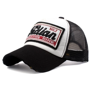 Detail of classic black and white trucker hat with Indian embroidery and mesh back