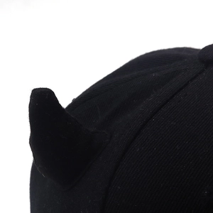 Hip-hop baseball cap with black devil horns featuring premium twill fabric texture