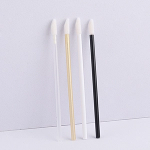 Close-up of disposable lip brushes with flocked tips in various handle colors