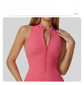 Detailed view of the pink stand collar and front half-zipper on the yoga bodysuit