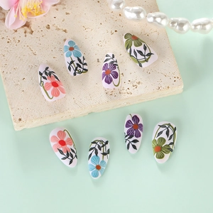 Vintage matte floral press-on nails with multi-color flower patterns on almond shape nails