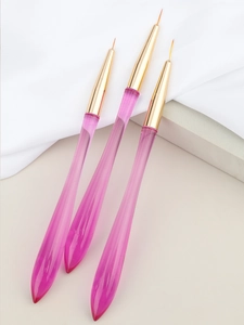 Detailed view of three pink translucent resin nail art liners with fine synthetic bristles