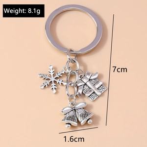 Silver alloy Christmas keychain featuring snowflake, gift box, and 1.6cm bell charms