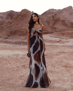 Detail of waist cut-out and abstract brown tie-dye pattern on flowy maxi dress