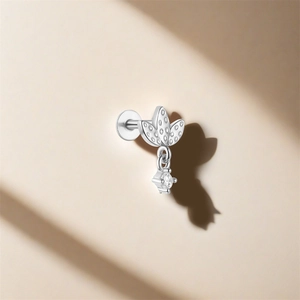 Close-up of S925 silver stud earring featuring three zircon leaves and a teardrop pendant