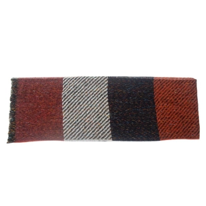 Macro shot of plaid knit scarf with deep red, grey, and orange striped texture