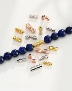 Detail of silver and gold spiral screw clasps for DIY jewelry necklace making