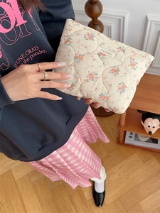 Quilted floral makeup bag with retro flower patterns and soft cotton padded texture