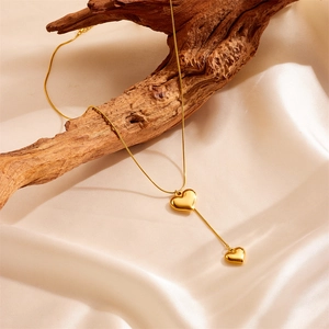 Golden titanium steel Y-shaped necklace with double heart pendants and snake chain