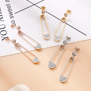 Boucles d'oreilles cœur trombone en or, argent et or rose ornées de strass brillants