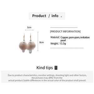 Detail view of drop C earrings with size info 3x8cm and pom-pom pearl materials