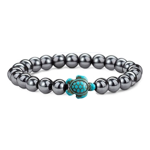 Elastic beaded bracelet with dark metallic hematite beads and turquoise sea turtle pendant
