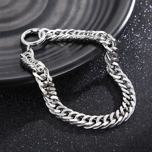 Macro detail of silver titanium steel Cuban link bracelet with round spring clasp