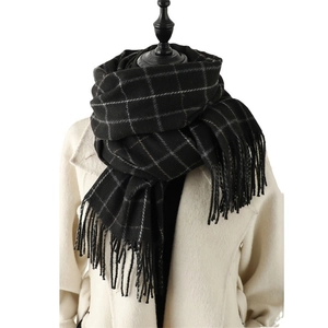Classic black plaid checkered tassel scarf worn on mannequin for winter styling